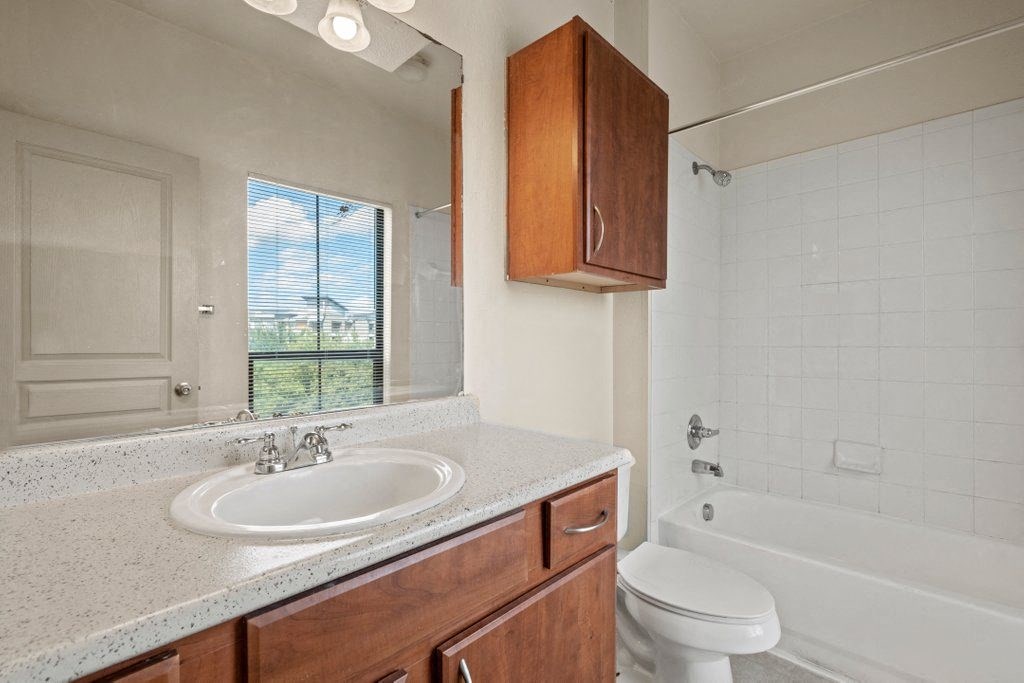 a bathroom with a sink toilet and bathtub