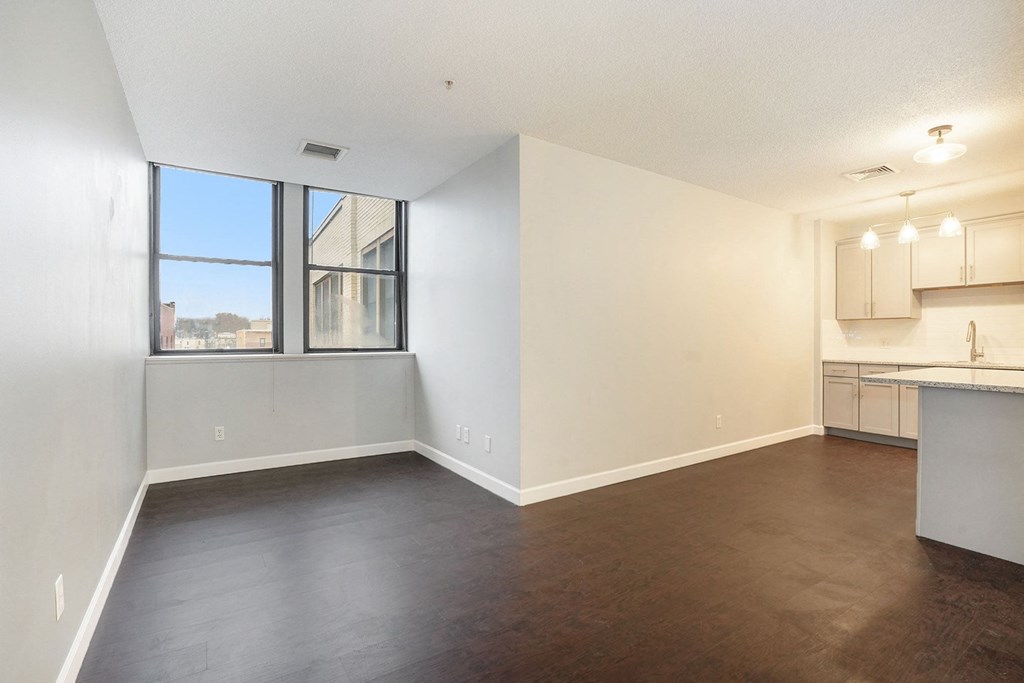 The Lofts Apartments In Grand Rapids, MI Marble Countertop Kitchen and Hardwood Floors