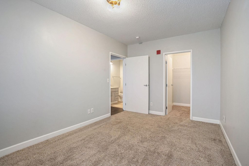 The Lofts Apartments in Grand Rapids, MI Open Concept Living Room with Hardwood Floors and Marble Countertop Kitchen