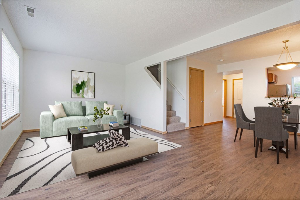 Savannah Trace Apartments living room and dining room with a couch and a table