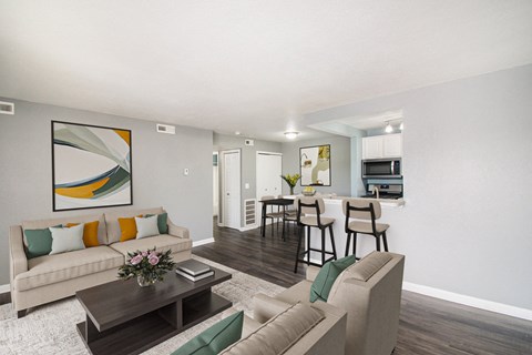 the living room of an apartment with a couch and a table