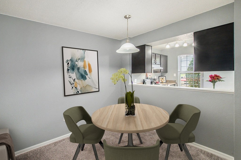 our apartments offer a dining room with a table and chairs