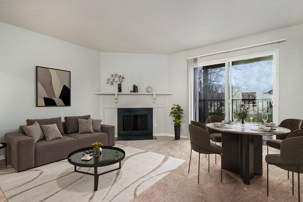 a living room with a couch and a table and a fireplace