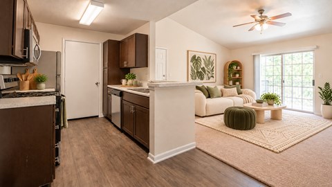 A kitchen with brown cabinets and a white refrigerator.