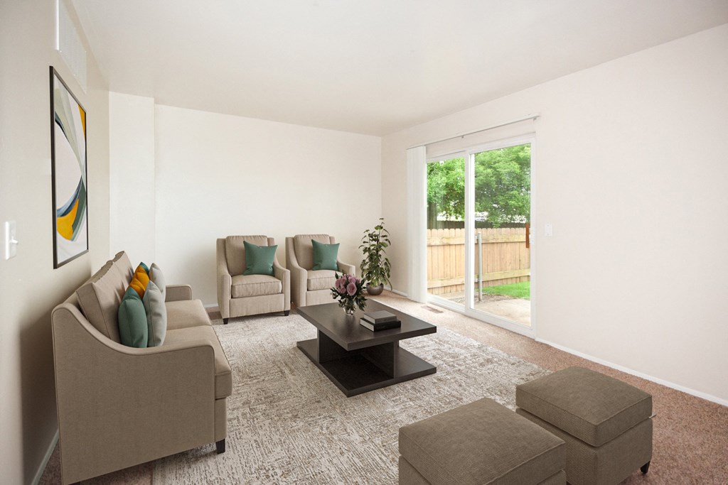a living room with couches and chairs and a coffee table