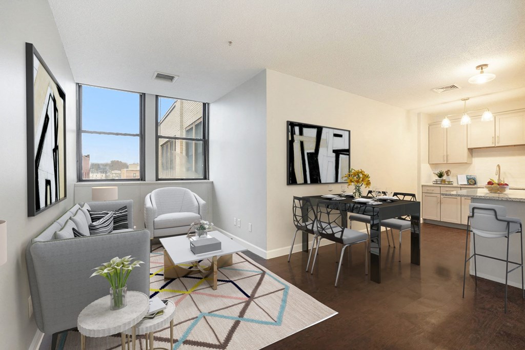 a living room and dining room with a table and chairs