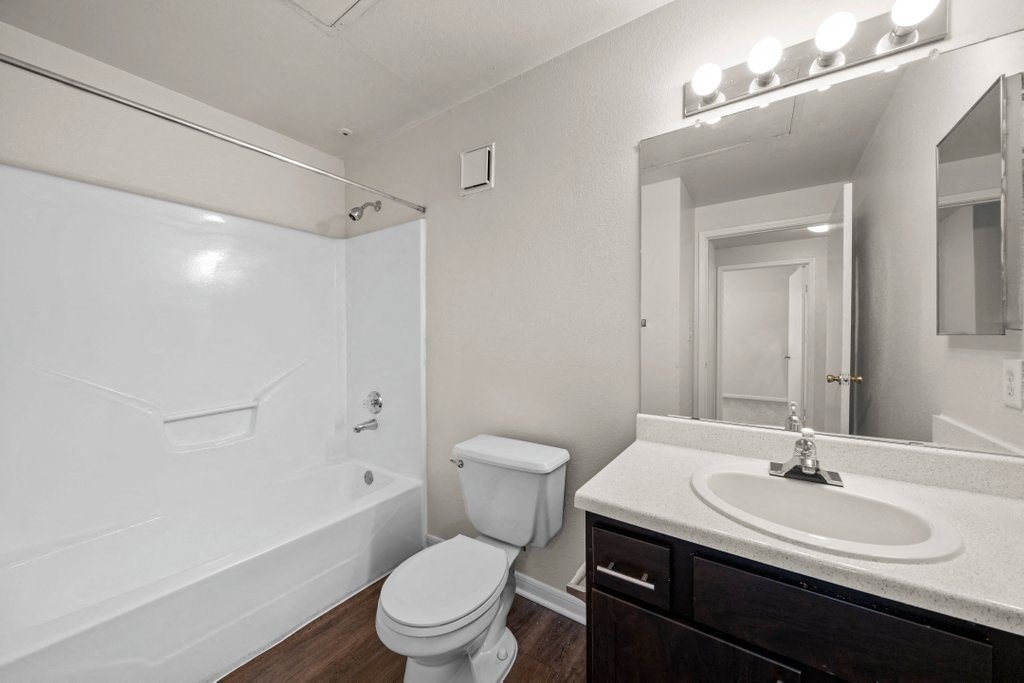 a bathroom with a sink toilet and bathtub