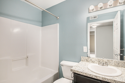 a bathroom with a toilet sink and bathtub