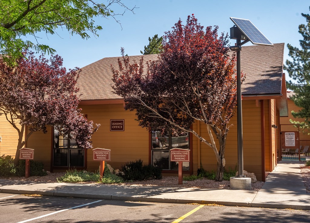 A yellow building with a sign that says "Landing Office" on it.