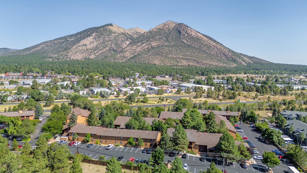 A mountain is in the background of a town.