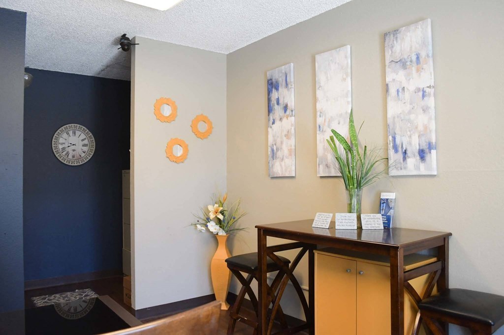 a dining room with a table and chairs