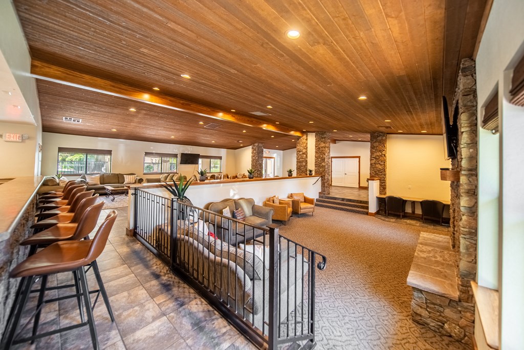 A long hallway with a row of chairs on the left side.