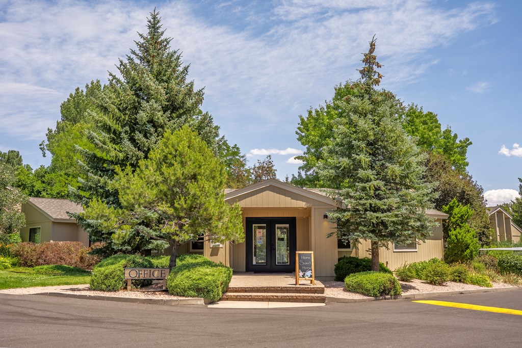 A building with a sign that says "OFFICE" in front of it.