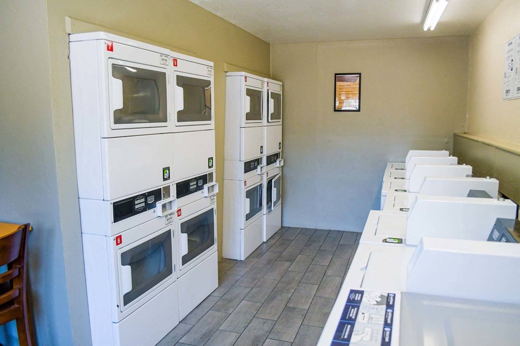 a room filled with lots of white microwaves