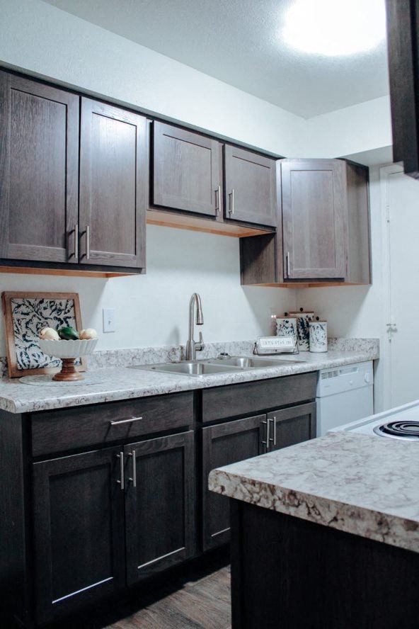 a kitchen with a sink and a stove