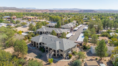 A bird's eye view of a Sagewood Apartments and trees.