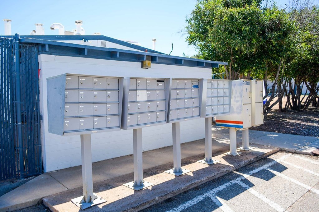 a row of mailboxes in front of a building