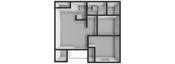 A black and white image of a room with a kitchenette and a small bed.