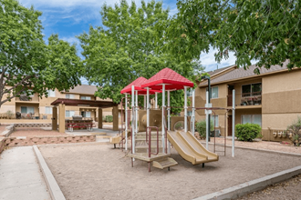 our apartments have a playground for kids and a picnic table