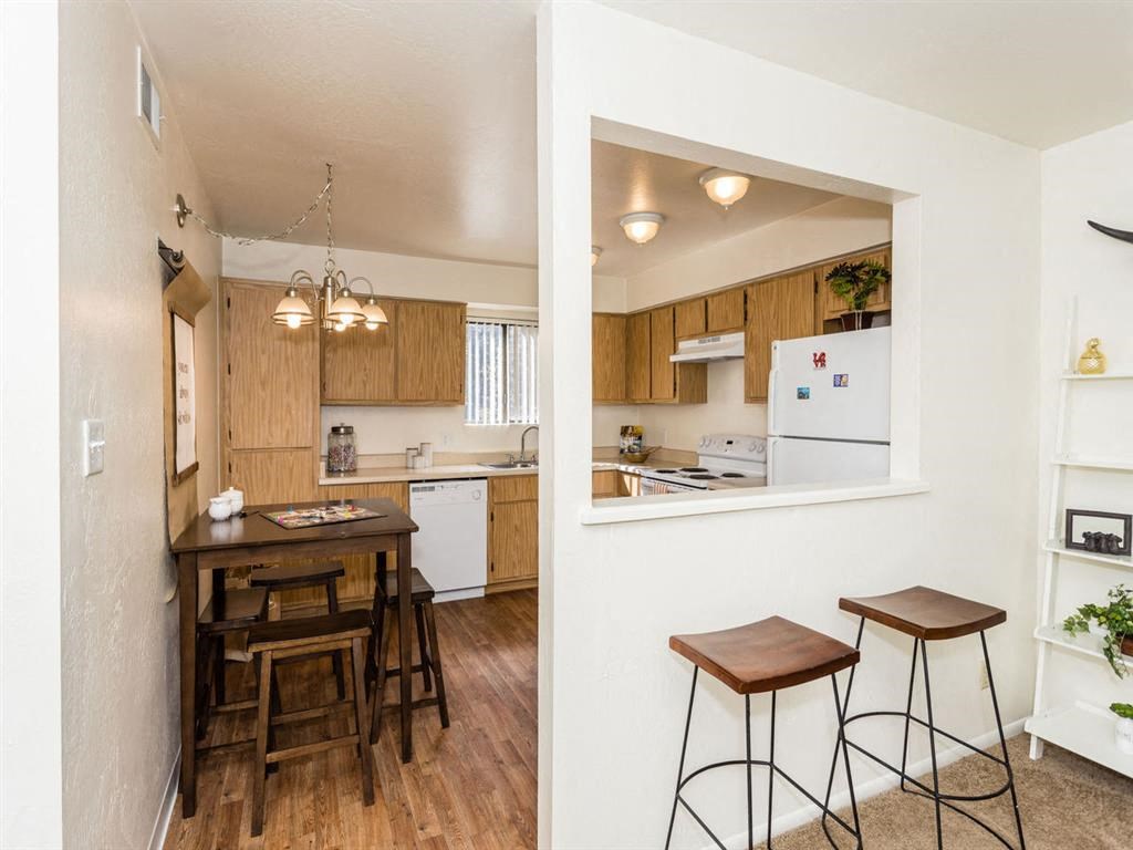 Fitted Kitchen With Island Dining at University Square Apartments, Flagstaff, AZ, 86001