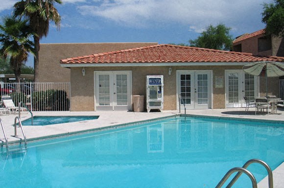 a swimming pool in front of a building