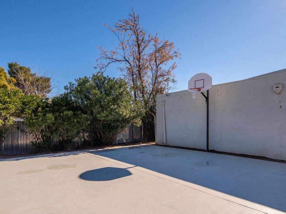 a basketball hoop on the side of a house