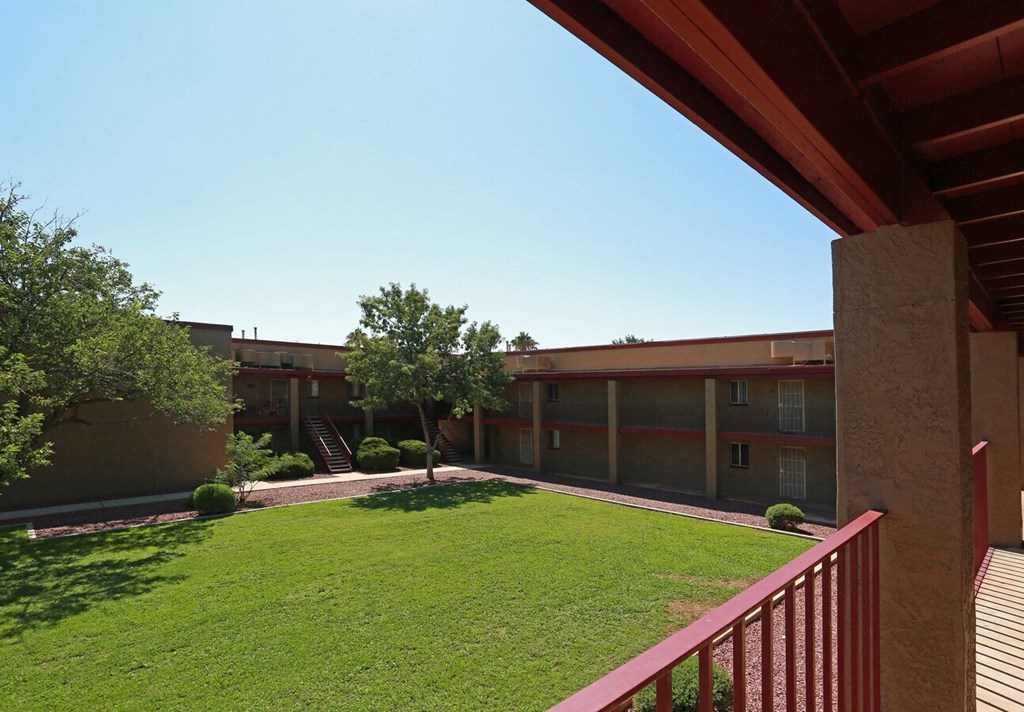 a courtyard viewed from an apartment patio