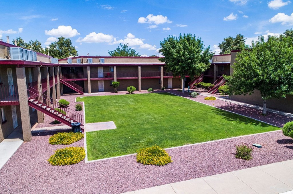 view of a courtyard between apartment homes with landscaping