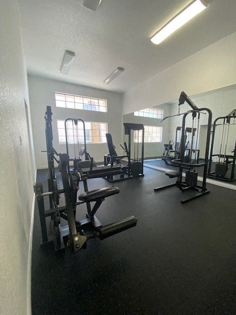 a gym with weights and other equipment in it