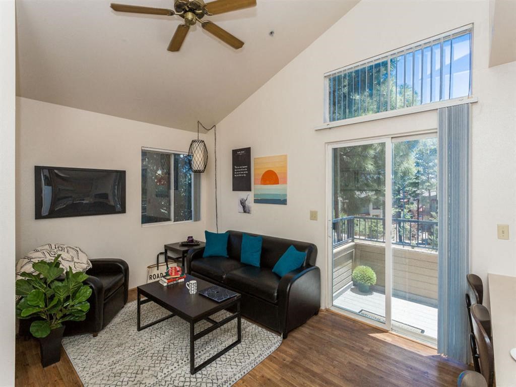 Living Room With Private Balcony at Highland Village Apartments, Flagstaff