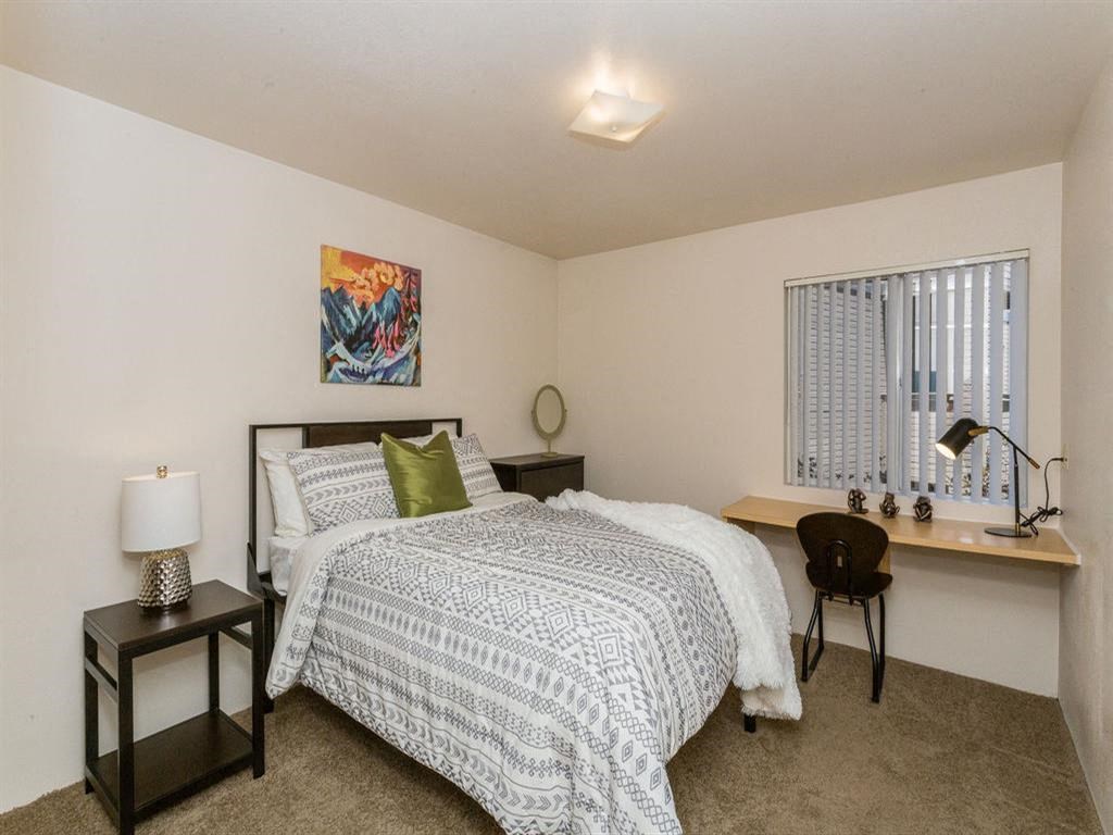 Spacious Bedroom With Comfortable Bed at Highland Village Apartments, Flagstaff, AZ, 86001