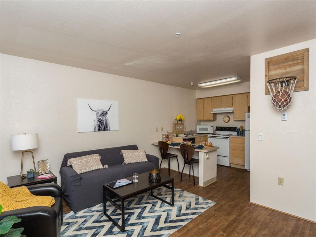Modern Living Area With Kitchen View at Highland Village Apartments, Flagstaff, Arizona