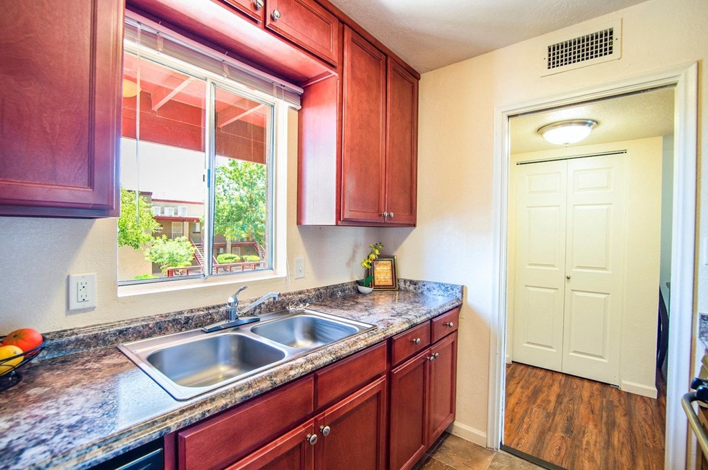 a kitchen with a sink and a window