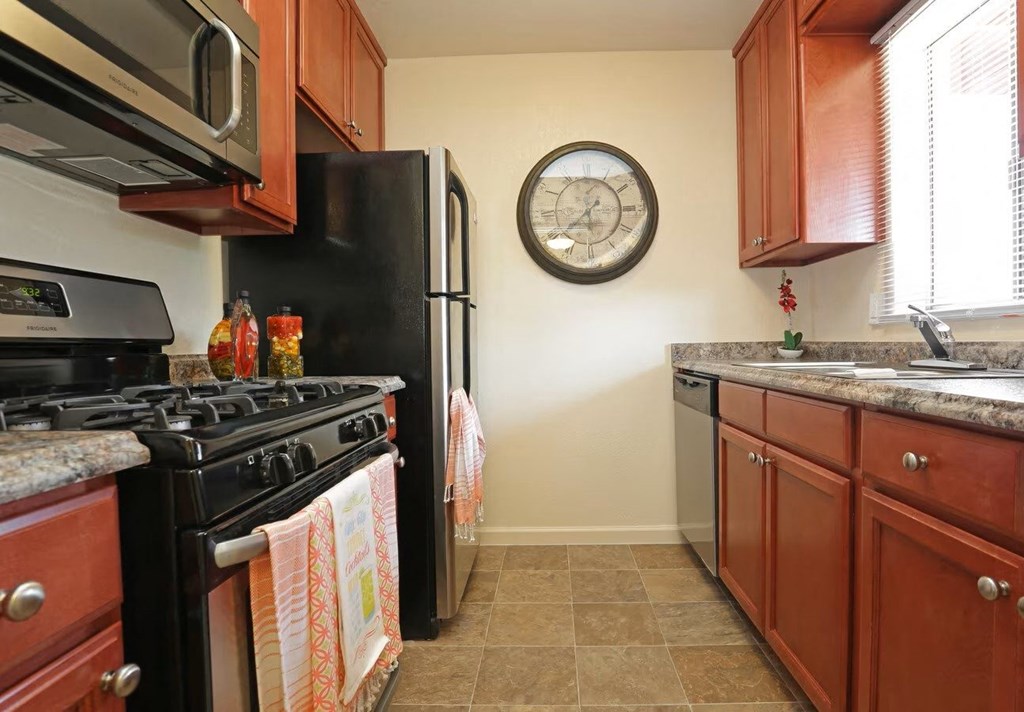 kitchen with stainless steel appliances and a window