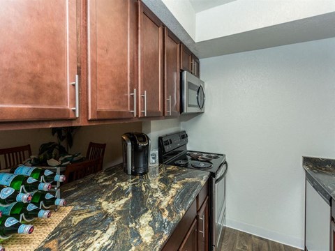 a kitchen with a counter top and a microwave