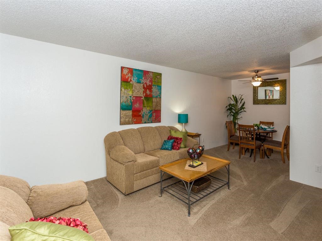 Living Room With Kitchen View at Butterfield Apartments, Flagstaff, AZ 86004
