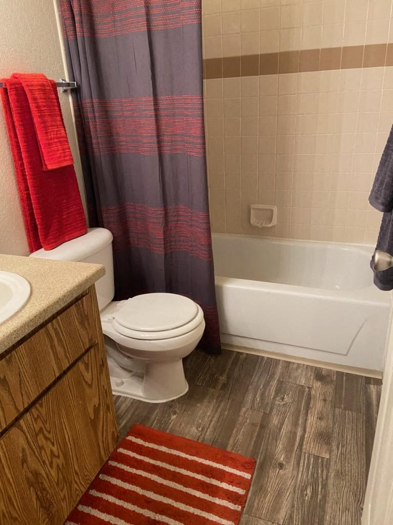 a bathroom with a toilet sink and bathtub