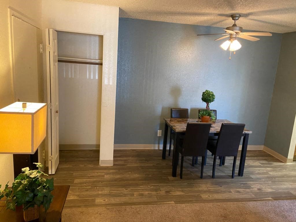 a dining room with a table and chairs