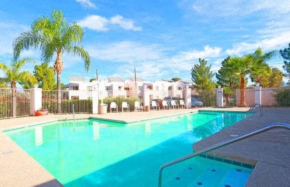 a large pool with a fence around it