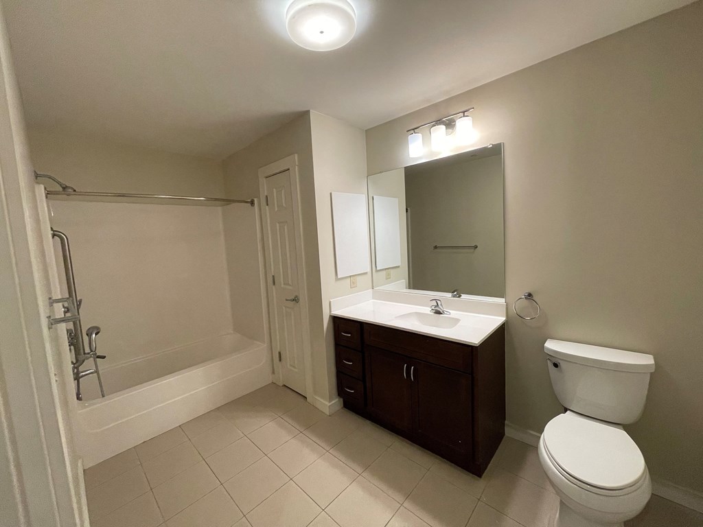 a bathroom with a sink toilet and a shower