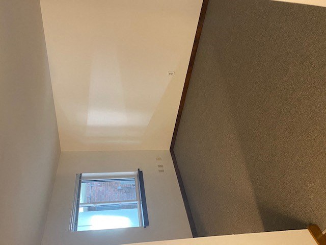 a small window in the ceiling of a room