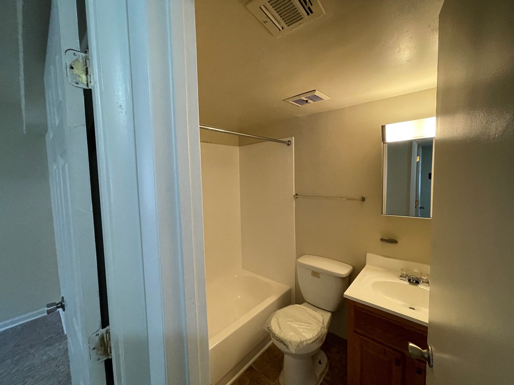 a bathroom with a bathtub and a sink