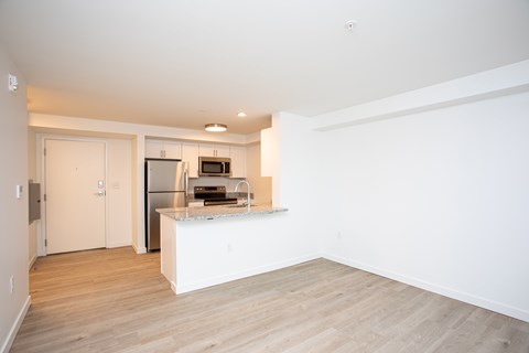 A kitchen with a refrigerator, microwave, and sink. A kitchen with a refrigerator, microwave, and sink.at The Camelot, West Hartford, CT