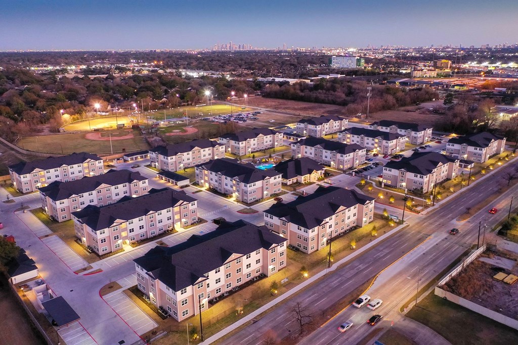 an aerial view of a neighborhood at night at 55 Fifty at Northwest Crossing, Texas, 77092