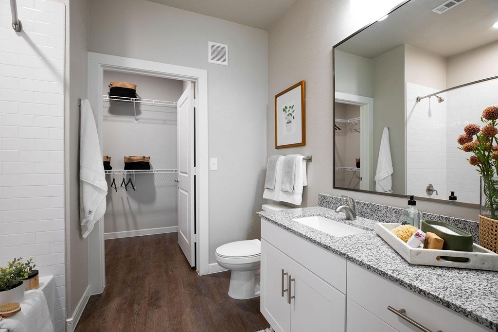 our apartments offer a bathroom with a shower at 55 Fifty at Northwest Crossing, Houston
