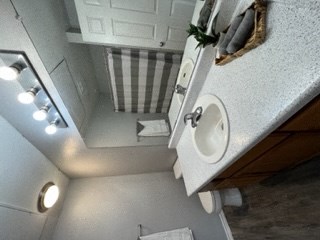 a small bathroom with a sink and a mirror