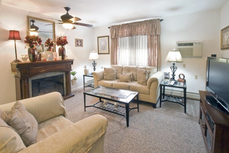 a picture of a living room with different chairs and a table
