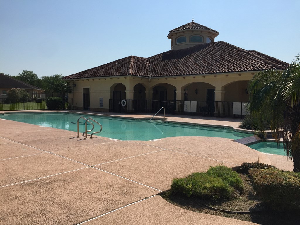 a swimming pool in front of a building