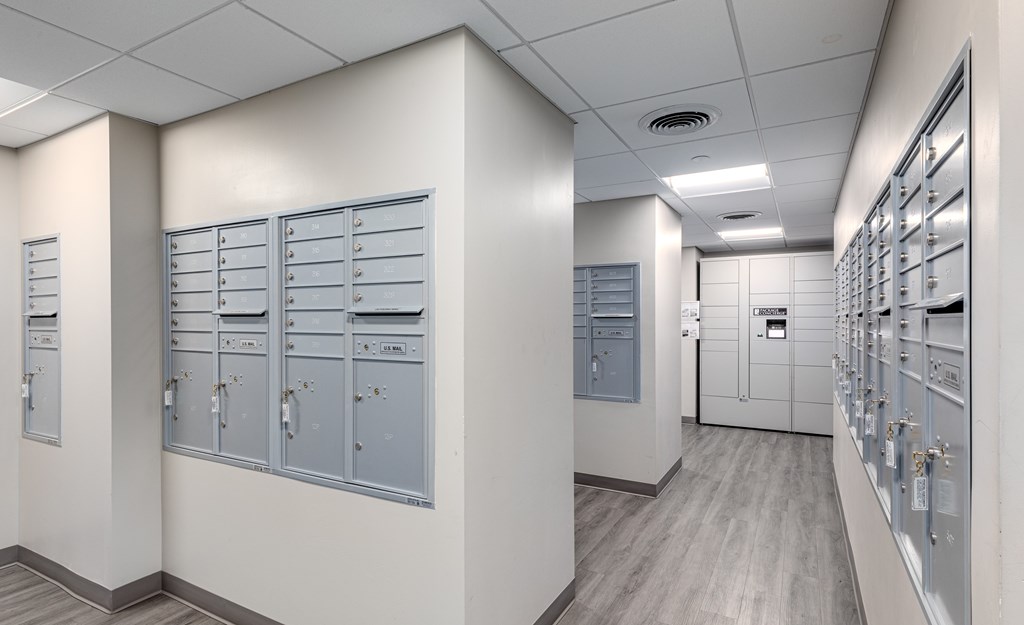 A long hallway with a row of lockers on the left and right.