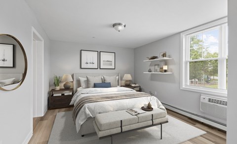 A bedroom with a large bed and a window.